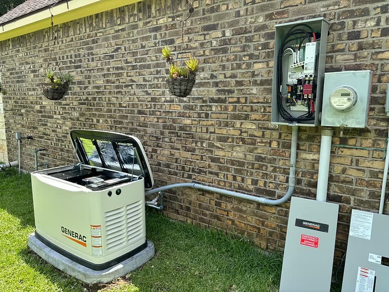 Generac standby generator with transfer switch and meter, installed by Orthodox Electric in the Brazos Valley