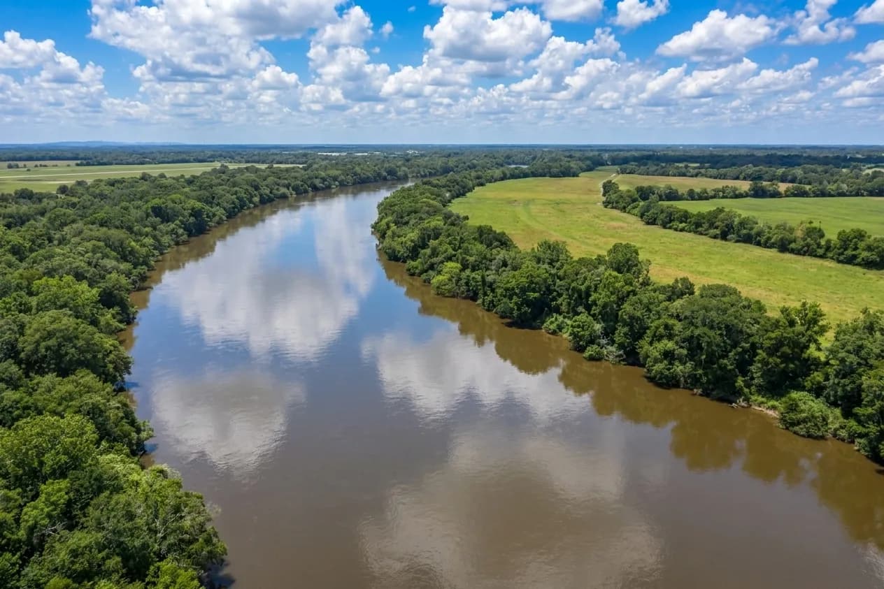 Aerial view of the Brazos River winding through the Brazos Valley, the area Orthodox Electric serves
