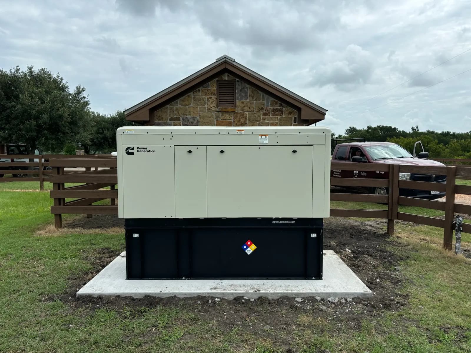 Cummins commercial standby generator on a concrete pad at a Brazos Valley property